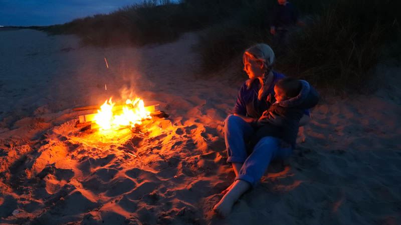 uk staycation in england wild camping and camp fire on the beach